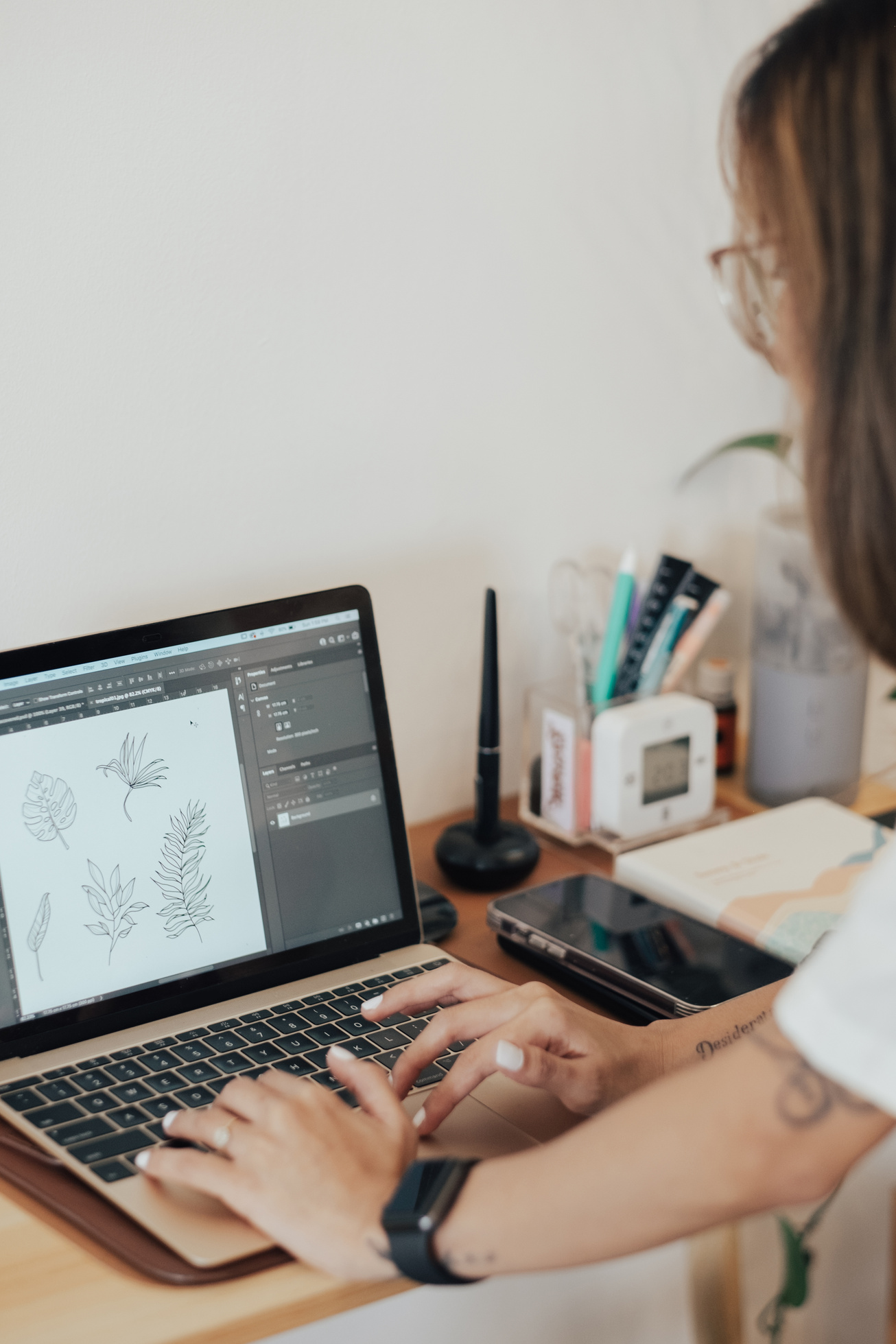 Female Designer Working with Laptop in Studio